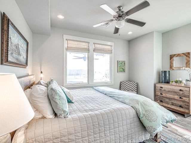 bedroom with recessed lighting, ceiling fan, and wood finished floors