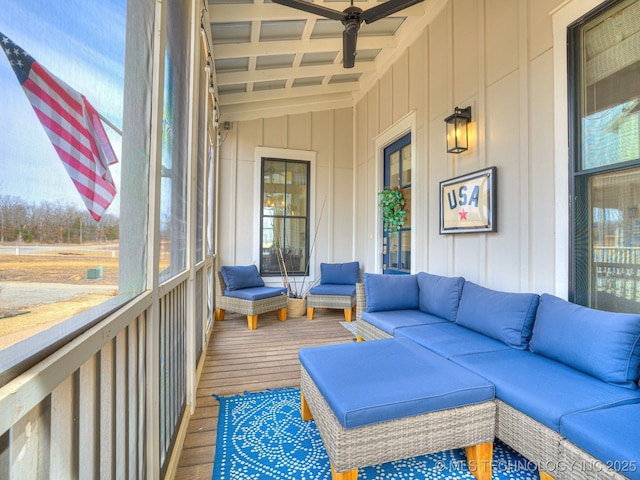sunroom with an outdoor hangout area, plenty of natural light, ceiling fan, and beam ceiling