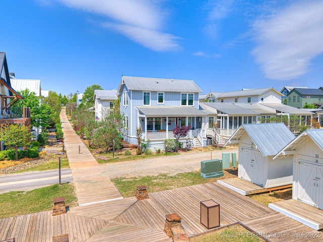 29 Boardwalk Unit F, Carlton Landing, OK 74432 - back of property with a shed, a metal roof, board and batten siding, a porch, and a wooden deck
