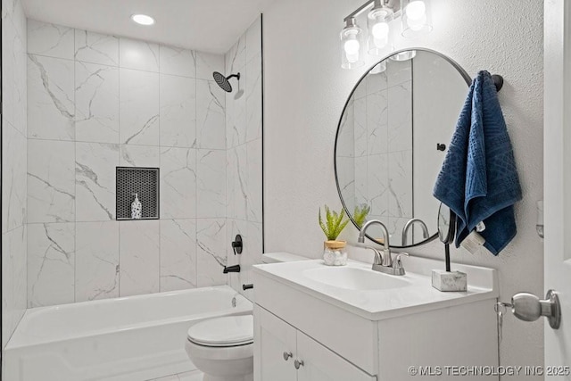 full bathroom with toilet, vanity, a textured wall, and washtub / shower combination