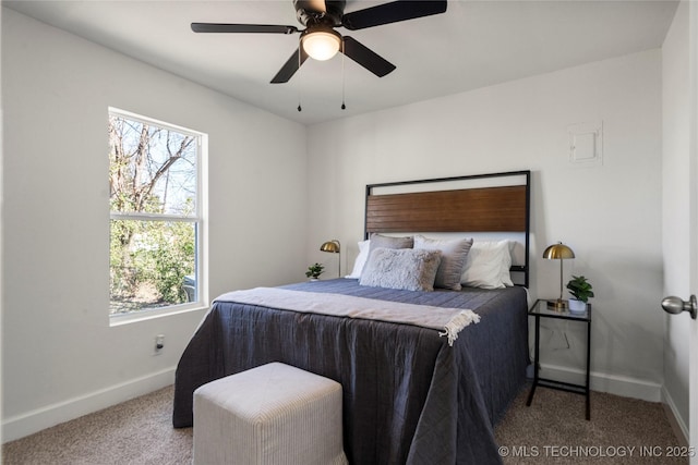 carpeted bedroom with baseboards and ceiling fan