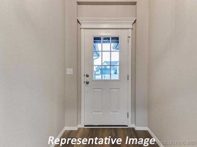 doorway to outside with dark wood-style floors and baseboards