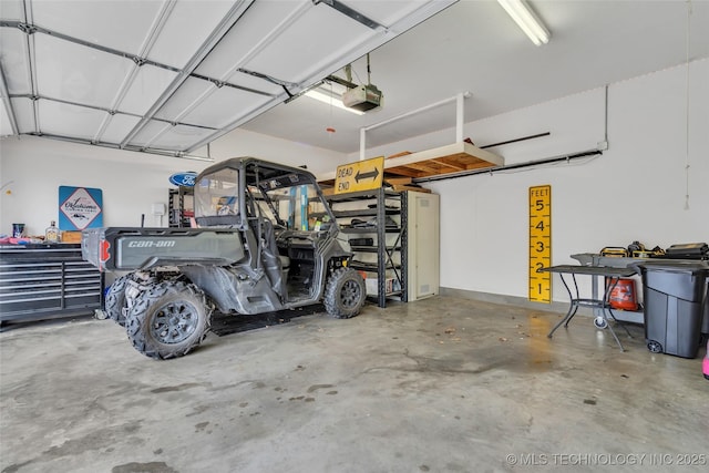 garage featuring a garage door opener