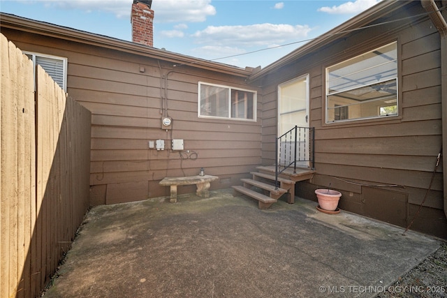 view of patio / terrace featuring fence