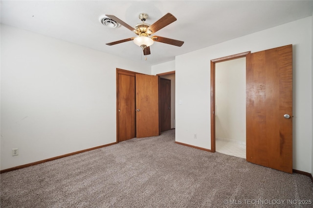 unfurnished bedroom with a closet, ceiling fan, baseboards, and carpet