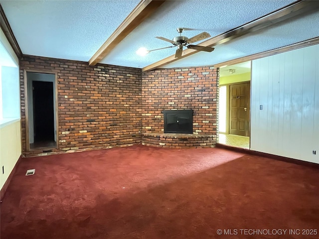 unfurnished living room featuring carpet, a ceiling fan, visible vents, a textured ceiling, and beamed ceiling