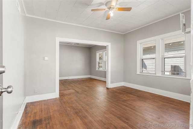 spare room with plenty of natural light, crown molding, and a ceiling fan