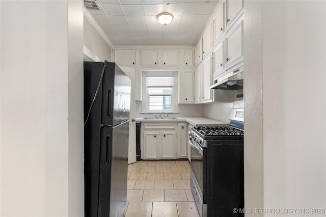 kitchen featuring visible vents, under cabinet range hood, light countertops, black appliances, and a sink