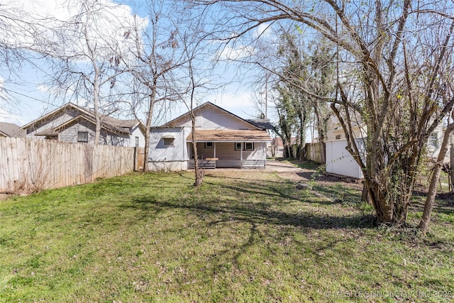 view of yard with an outbuilding and fence private yard