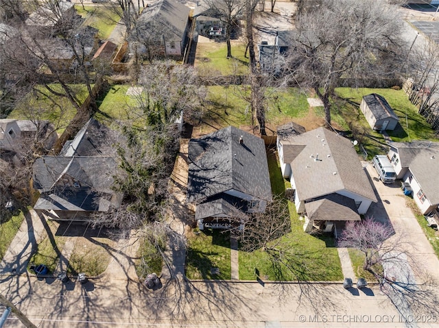 birds eye view of property with a residential view