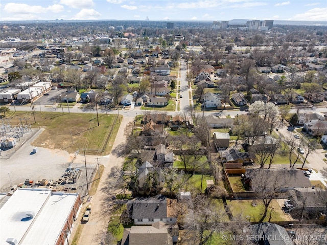 birds eye view of property with a residential view