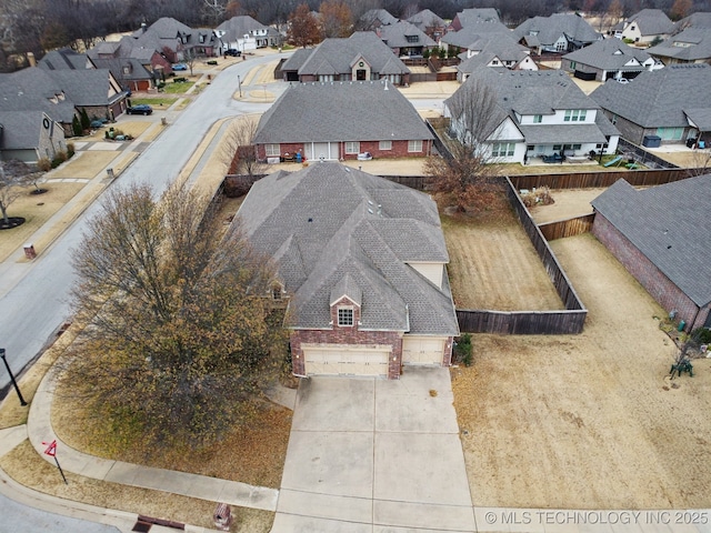 birds eye view of property with a residential view