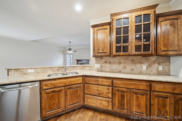 kitchen with glass insert cabinets, ceiling fan, dishwasher, ornamental molding, and a sink