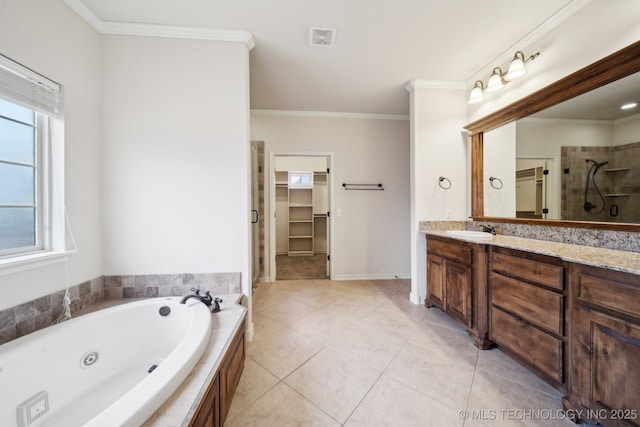 full bathroom featuring tile patterned floors, visible vents, a walk in closet, ornamental molding, and vanity