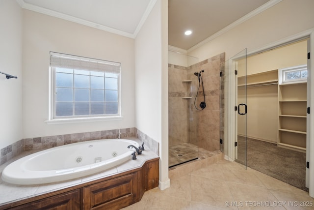 bathroom featuring tile patterned floors, a whirlpool tub, a shower stall, and crown molding