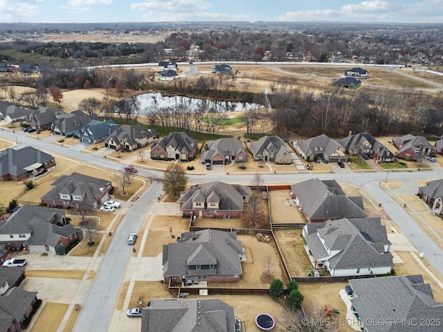 aerial view with a residential view and a water view