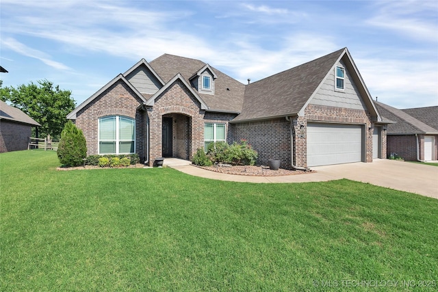 view of front facade featuring a front yard, an attached garage, brick siding, and driveway