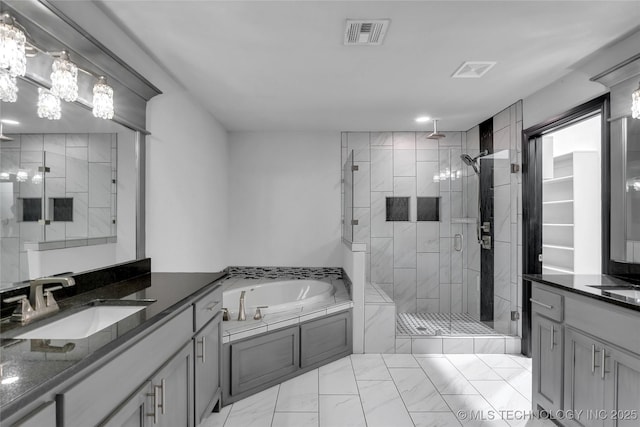 bathroom featuring visible vents, a stall shower, a bath, marble finish floor, and a sink