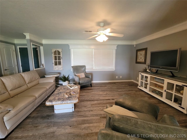 living area featuring ornamental molding, wood finished floors, visible vents, and ceiling fan