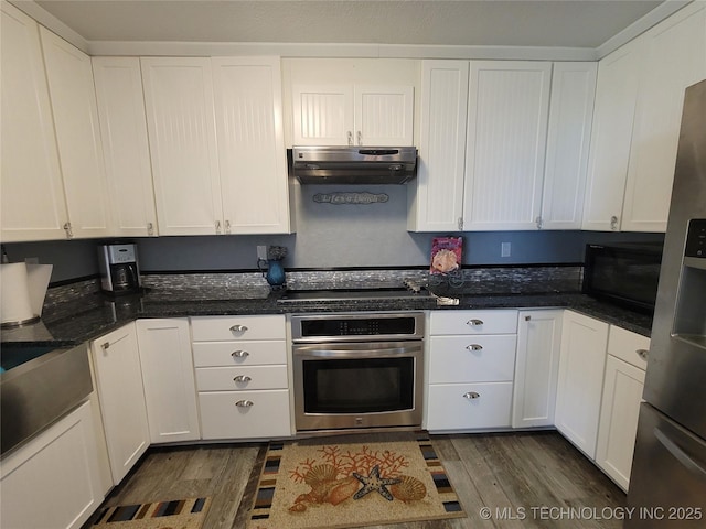 kitchen featuring under cabinet range hood, black appliances, and white cabinets