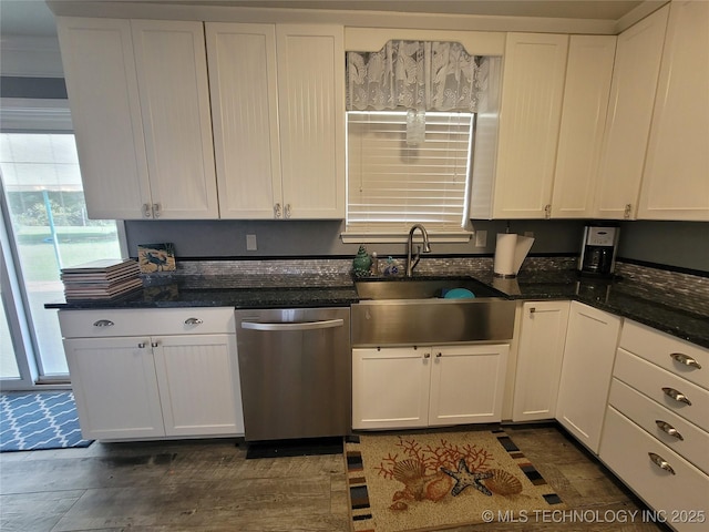 kitchen featuring dishwasher, white cabinetry, and a sink