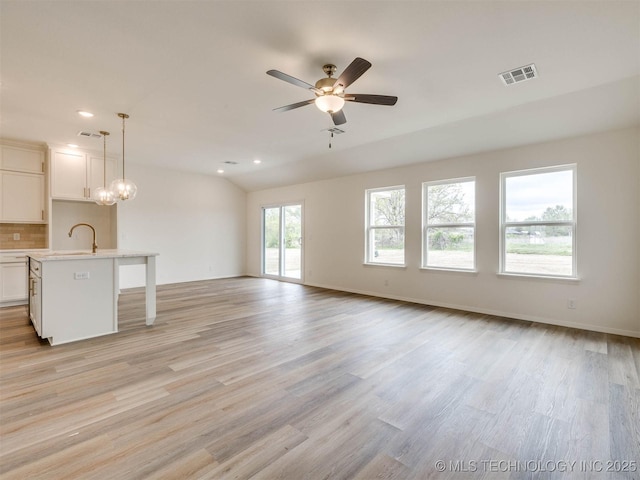 13404 E 123rd Pl, Collinsville, OK 74021 - unfurnished living room with light wood-type flooring, visible vents, recessed lighting, and ceiling fan