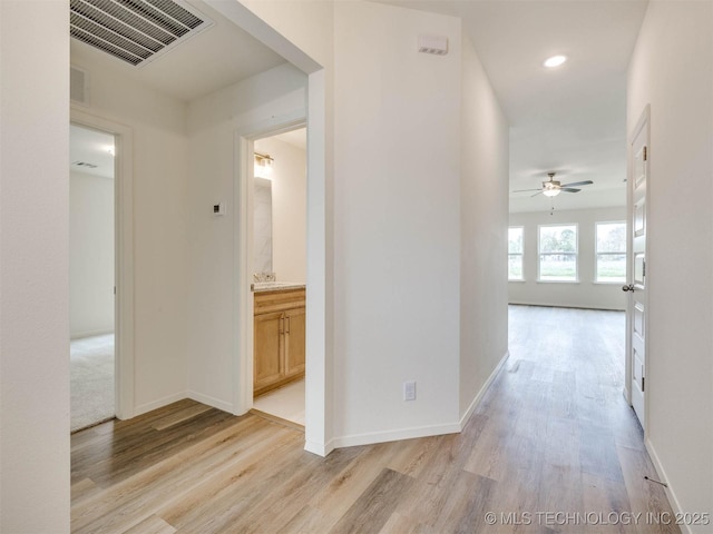 13404 E 123rd Pl, Collinsville, OK 74021 - hall with baseboards, light wood finished floors, and visible vents