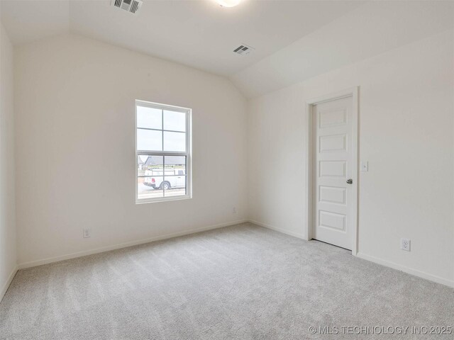 13404 E 123rd Pl, Collinsville, OK 74021 - carpeted spare room featuring lofted ceiling, visible vents, and baseboards