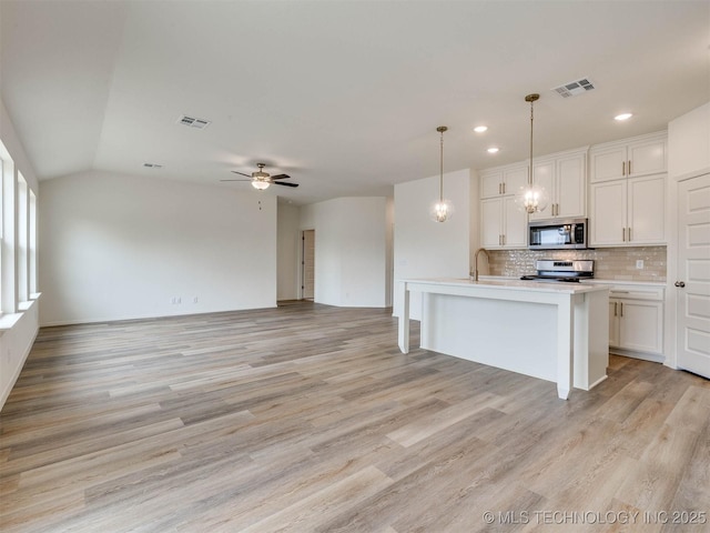 13404 E 123rd Pl, Collinsville, OK 74021 - kitchen with stainless steel appliances, visible vents, recessed lighting, and tasteful backsplash