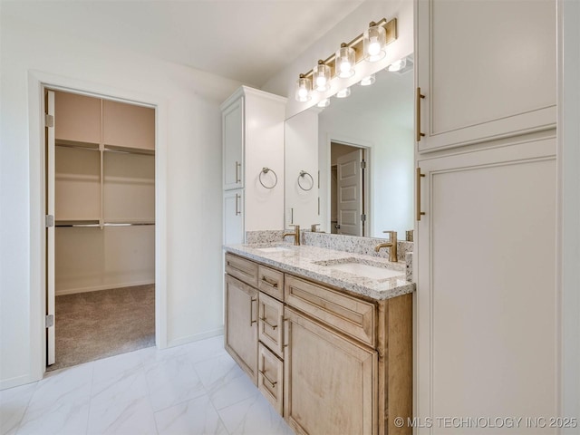 13404 E 123rd Pl, Collinsville, OK 74021 - full bathroom featuring a walk in closet, marble finish floor, a sink, and double vanity