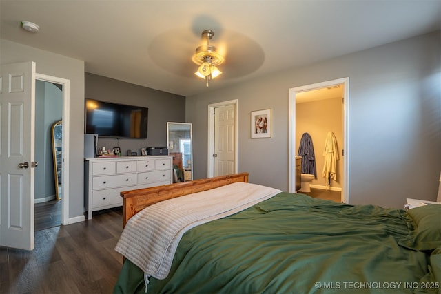 bedroom with connected bathroom, baseboards, ceiling fan, and dark wood-style flooring