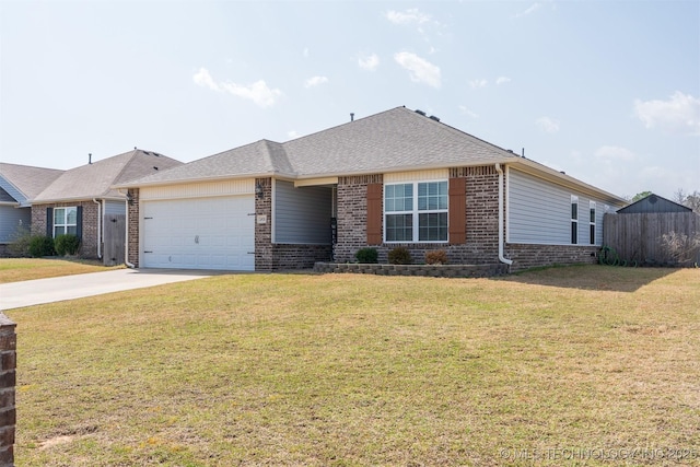 view of front of property with brick siding, a front lawn, fence, a garage, and driveway