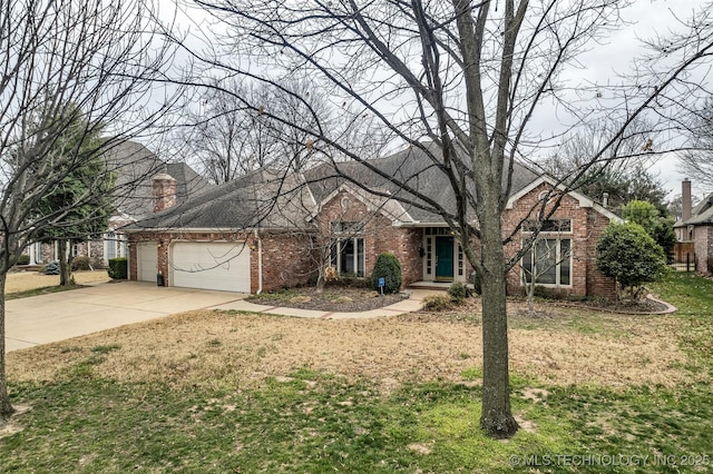 view of front of property featuring brick siding, an attached garage, driveway, and a front lawn