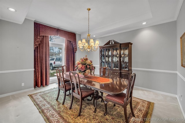 carpeted dining room featuring a notable chandelier, recessed lighting, baseboards, and ornamental molding