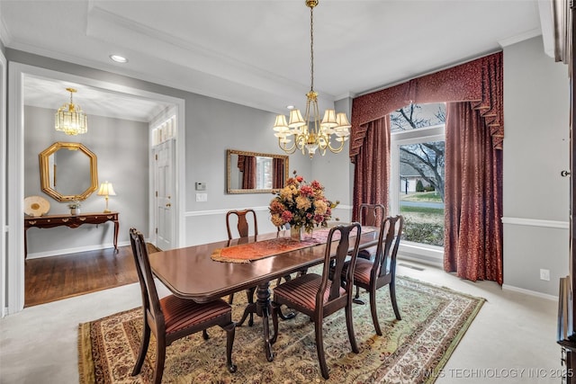 dining room featuring baseboards, a notable chandelier, and crown molding