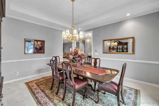 carpeted dining room with a chandelier, recessed lighting, baseboards, and a tray ceiling