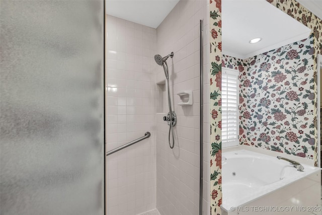 bathroom featuring wallpapered walls, a jetted tub, and a stall shower