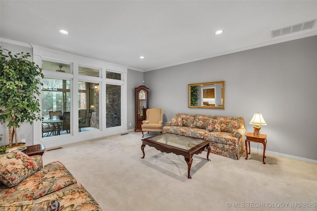 living area featuring crown molding, visible vents, and carpet floors