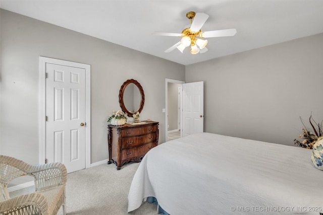 bedroom featuring ceiling fan, baseboards, and light carpet