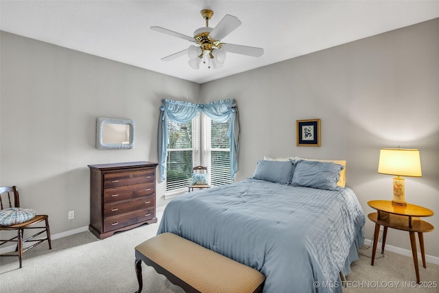 carpeted bedroom featuring ceiling fan and baseboards