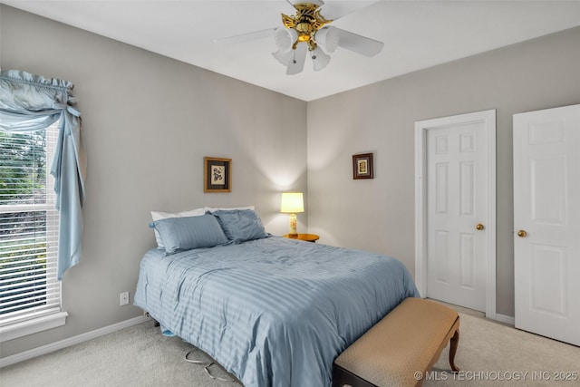 bedroom with baseboards, light carpet, and ceiling fan