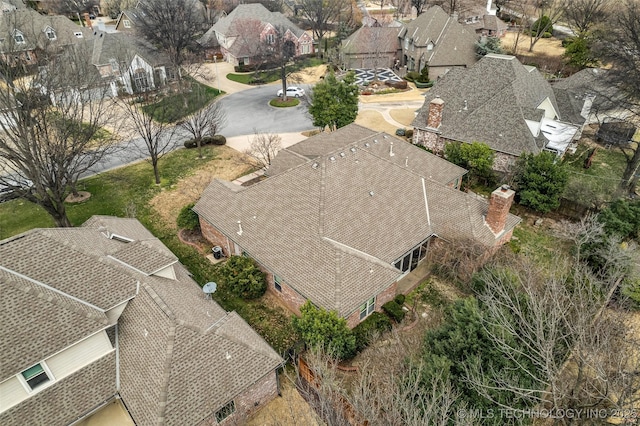 birds eye view of property with a residential view