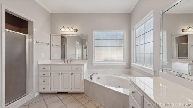 bathroom with tile patterned floors, a bath, a stall shower, and ornamental molding