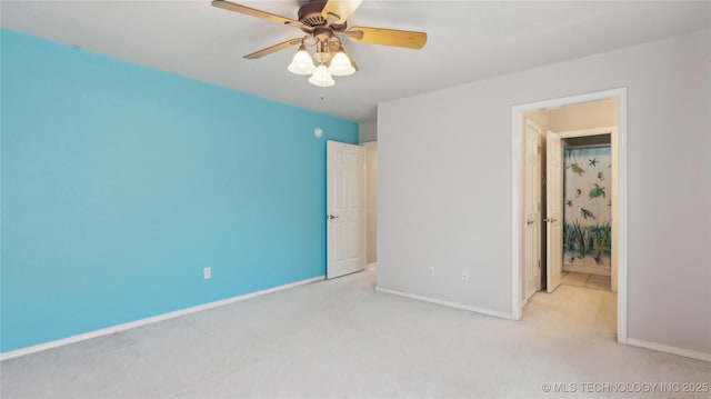 unfurnished bedroom featuring carpet flooring, a ceiling fan, and baseboards