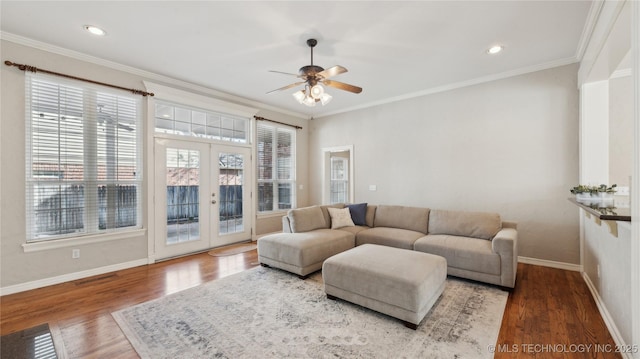 living area with french doors, wood finished floors, ceiling fan, and ornamental molding