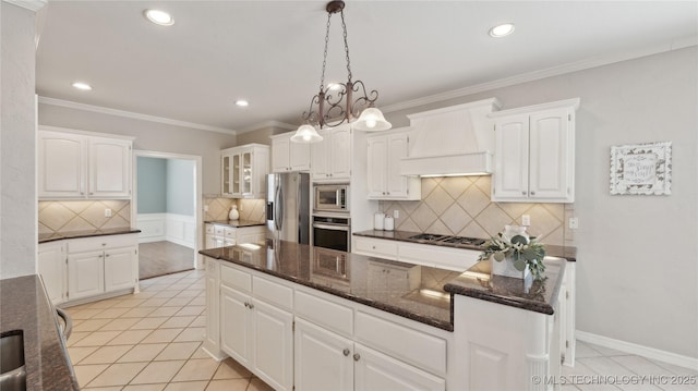 kitchen featuring ornamental molding, stainless steel appliances, white cabinets, light tile patterned flooring, and custom exhaust hood