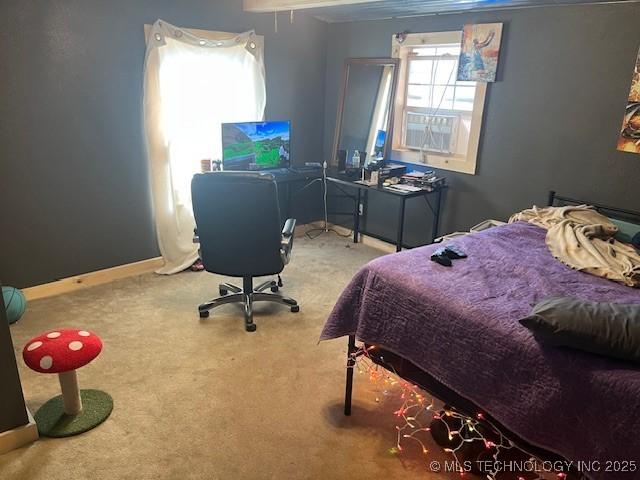 carpeted bedroom with baseboards