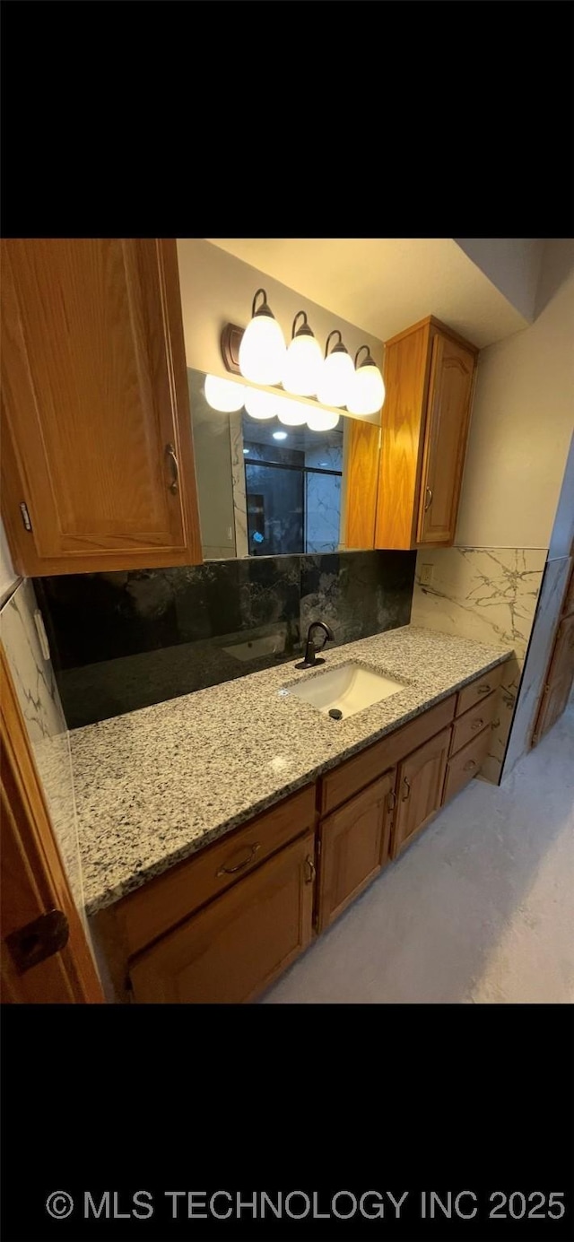 bathroom featuring vanity and marble finish floor