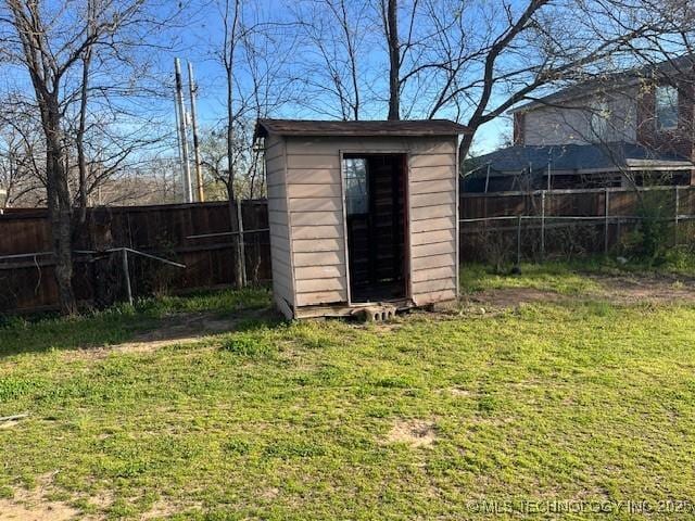 view of shed with a fenced backyard