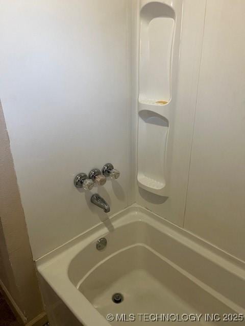 bathroom with shower / bath combination
